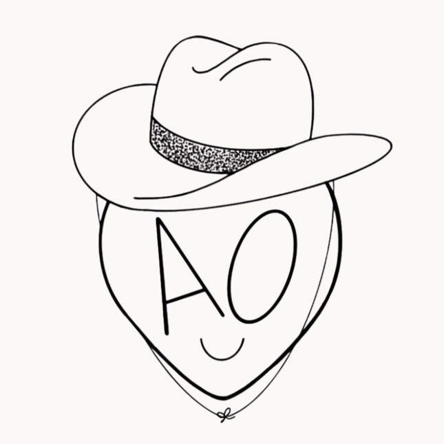 Howdy Slowpoke Logo A pink alien head smiling with a cowboy hat on